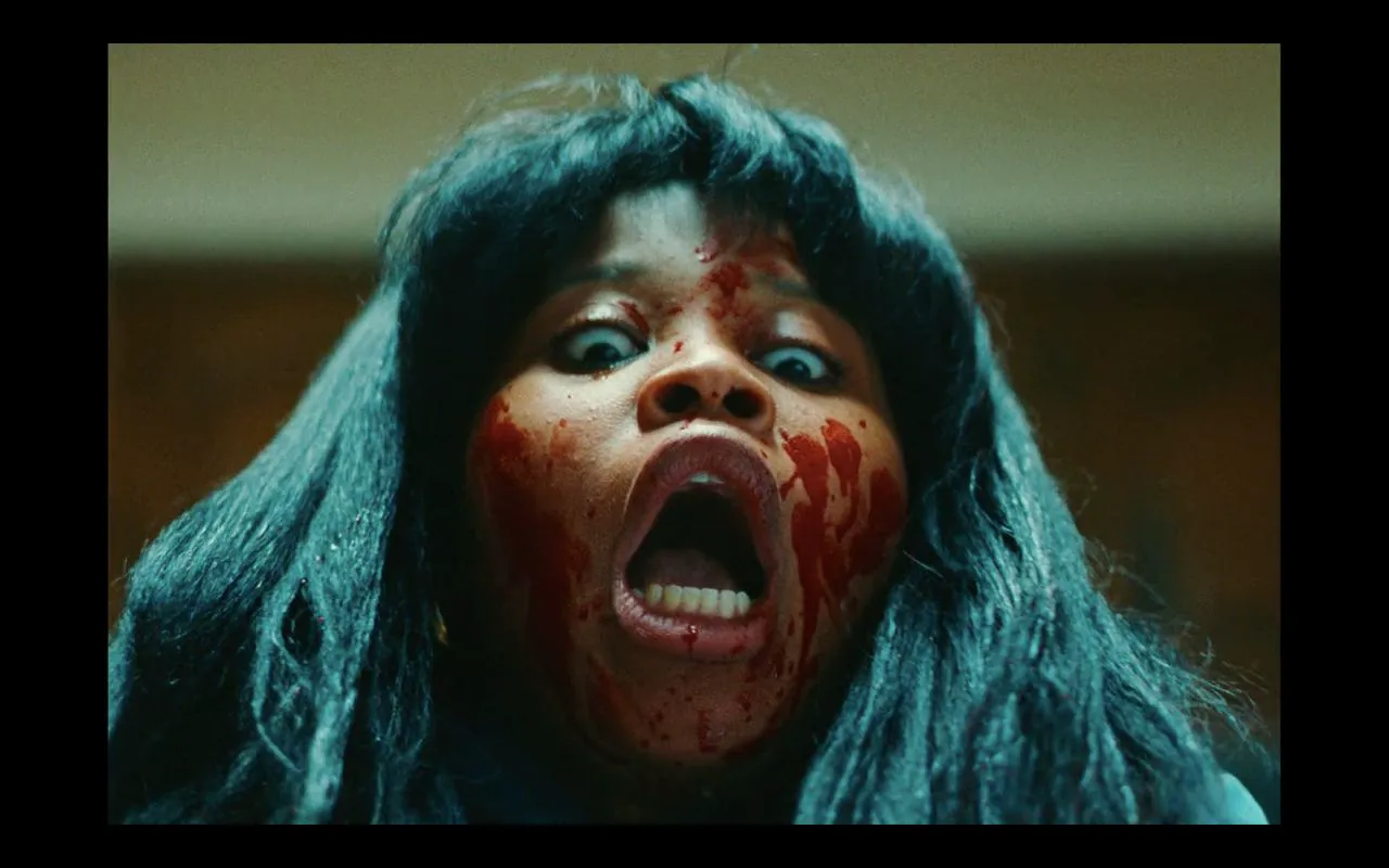 Dominique Fishback as Dre in 
