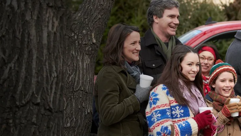The McCallister family happily reunited at home for Christmas, hugging Kevin warmly in front of their festive fireplace