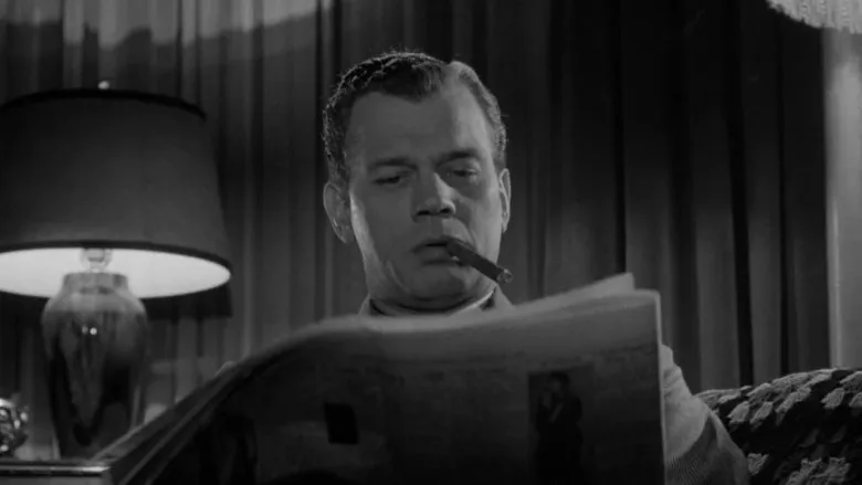 A sombre movie poster for 'Shadow of a Doubt' featuring Joseph Cotten and Teresa Wright, conveying suspense and drama.