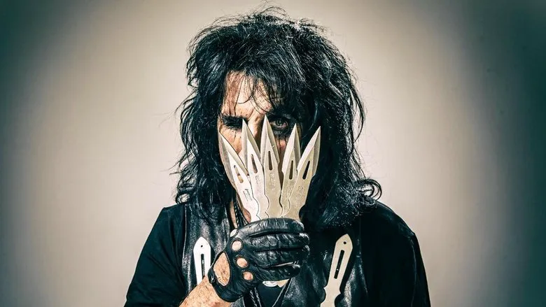 Alice Cooper with his band on stage