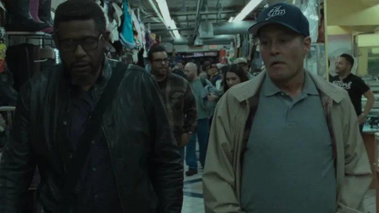 Movie still of the duo in a tense confrontation
