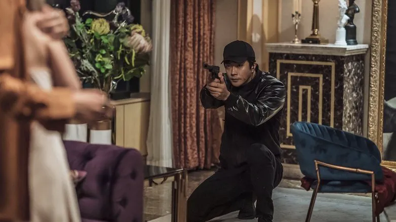 Ju Ji-hoon as Jung Moo-taek, a North Korean security official, displaying a look of intense suspicion and scrutiny, hinting at the increasing danger for Park Seok-young.