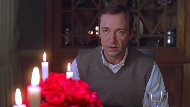 The iconic rose petal fantasy sequence, symbolizing Lester's desire and fantasy.