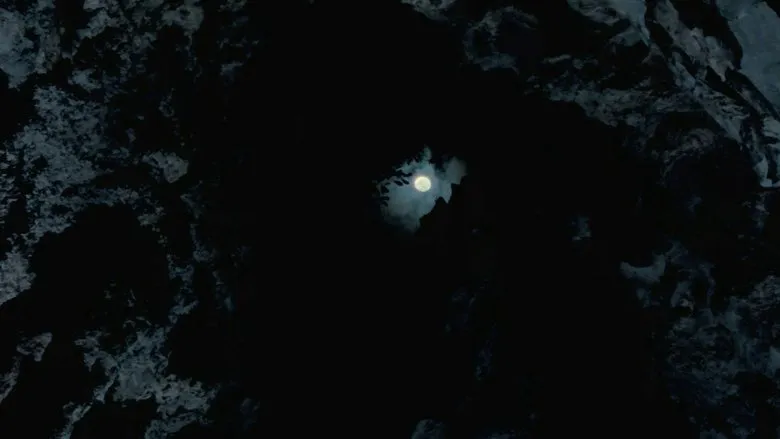 A mysterious ape-like creature with glowing red eyes, representing Boonsong's transformed state.