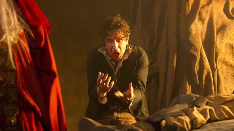 The Doctor and Donna Noble facing a mysterious blob-like creature in a tense scene