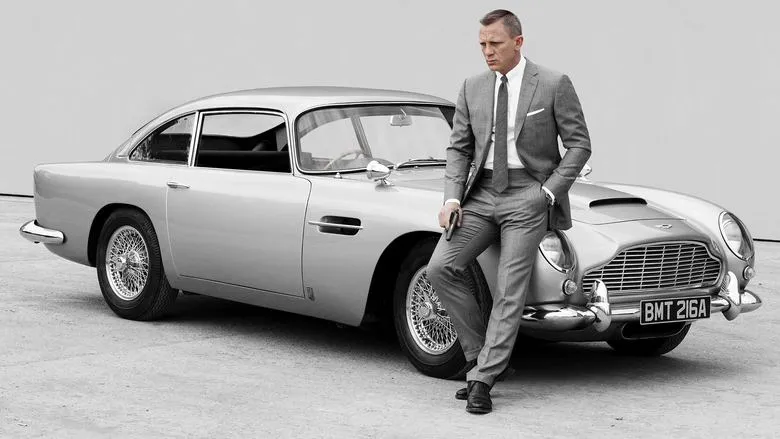 Daniel Craig as James Bond stands stoically, looking ready for action.