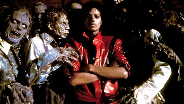 A black and white still showing Michael Jackson and director John Landis on the set of Thriller.